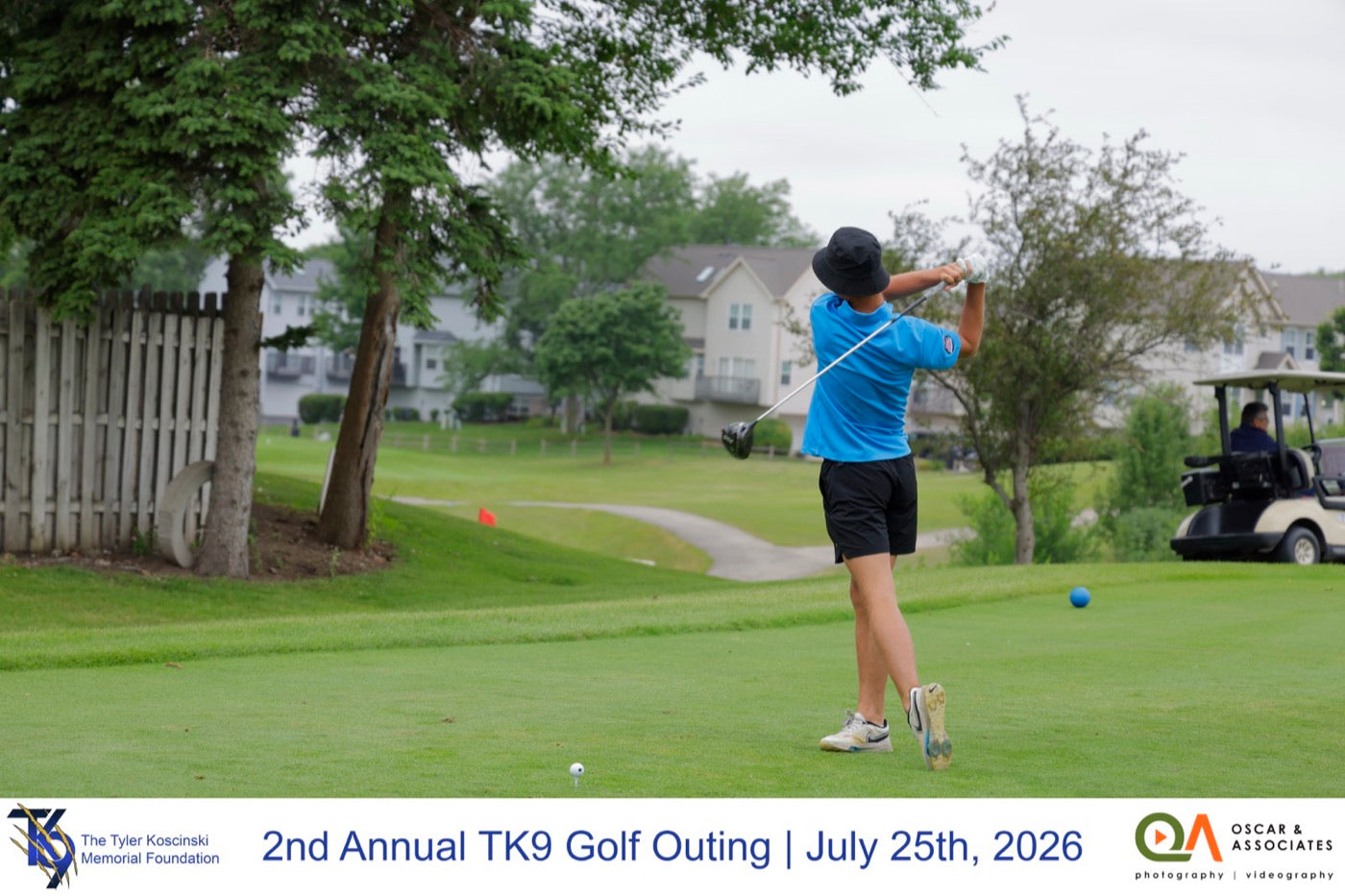 A golfer tees off