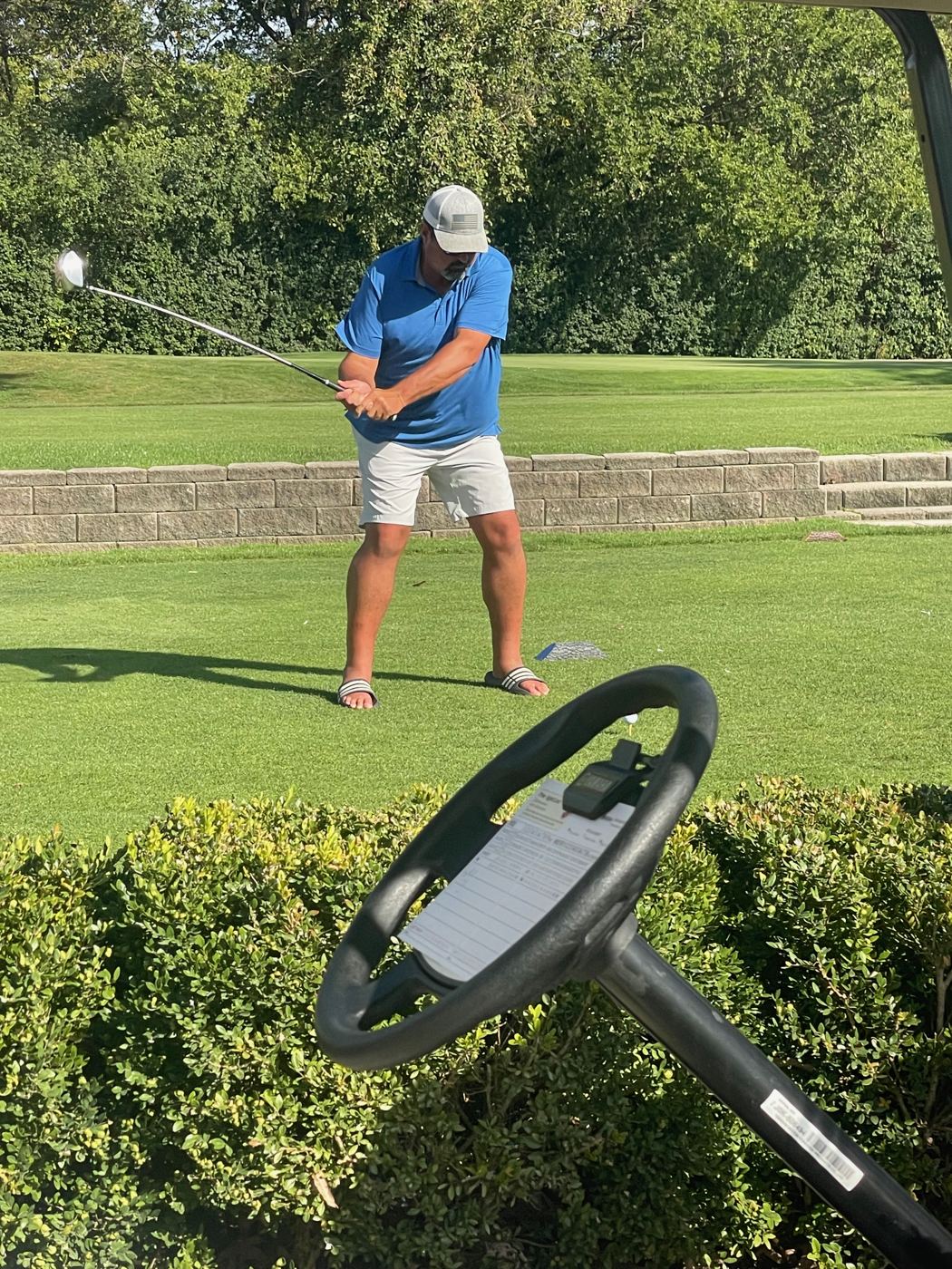 A golfer hitting from the tee